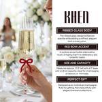 Single Ribbed Clear Champagne Glass with Red Bow on Stem